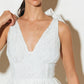 Woman in white lace dress.
