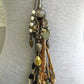 Beaded tassel pendant necklace on gray top