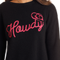 Black sweater with pink Howdy graphic.