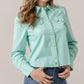 Annie in turquoise button-up crop top