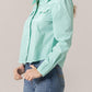 Annie in turquoise button-up crop top