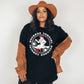 Woman in Bourbon Cowgirl tee and hat