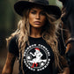 Blonde cowgirl with hat & Bourbon Cowgirl shirt, near horse