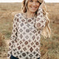 Brown and cream patterned top on woman