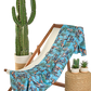 Beach towel on a deck chair with cactus and plants