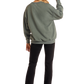 Woman in hat, sweatshirt, and black pants - BW91T05409
