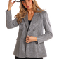 Woman in silver blazer and cowboy hat