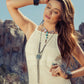 woman in white dress and jewelry
