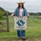 Woman in denim holding Made for Walkin' flag, DSC_5988