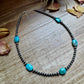 Turquoise bead necklace on wood - FullSizeRender