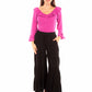 Woman in pink top & black pants
