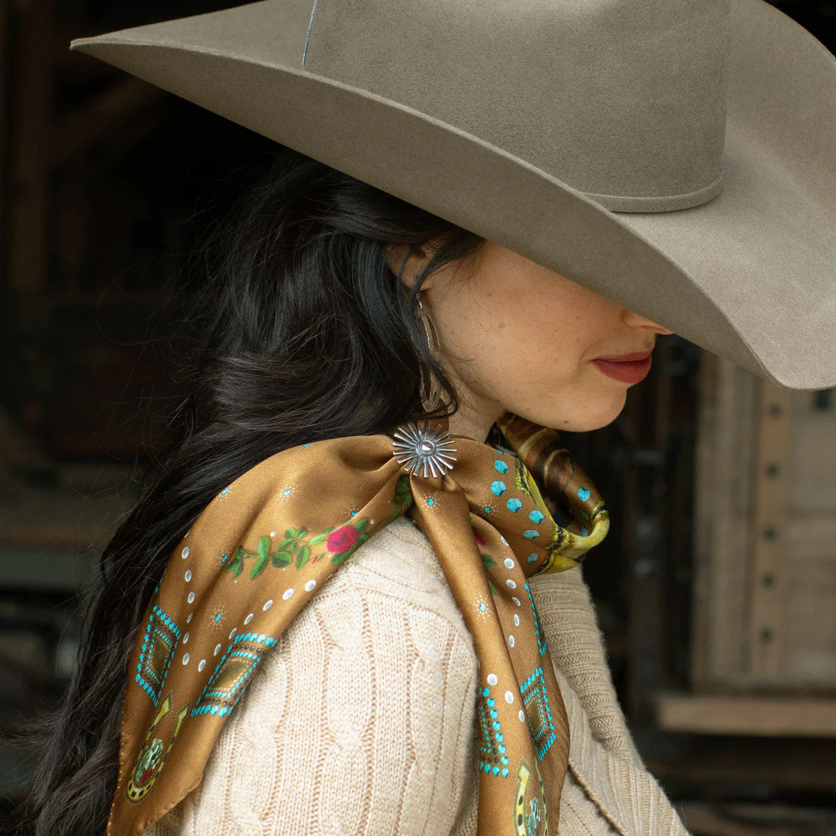 Woman wearing vintage western wild rag scarf and cowboy hat