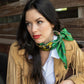 Woman wearing a vintage green fringe scarf, Hold Your Horses western style