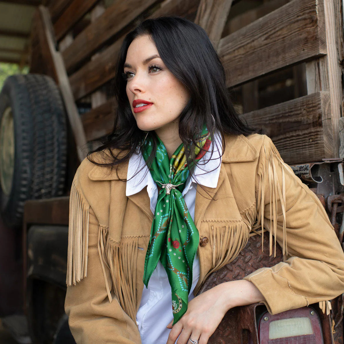 Woman wearing green fringe scarf and vintage western jacket