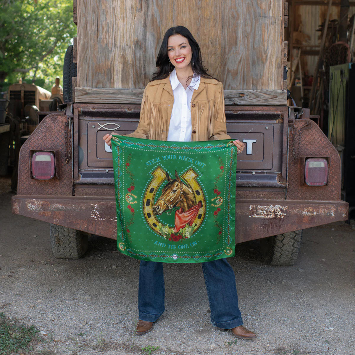 Woman holding green vintage western wild rag scarf