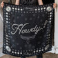 Black silk Howdy! wild rag scarf with concho details.