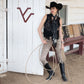 Cowgirl in black wild rag silk scarf and concho with rope