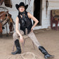 Cowgirl in black vest & silk scarf, concho detail