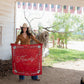 Cowgirl holding red Howdy silk scarf