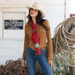 Cowgirl wearing red silk wild rag scarf and cowboy hat