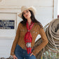Woman wearing red silk wild rag scarf with concho