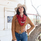 Cowgirl wearing red silk wild rag scarf and concho