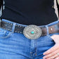 Cowboy belt buckle on jeans