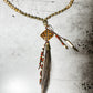 Necklace with beaded chain and pendant.