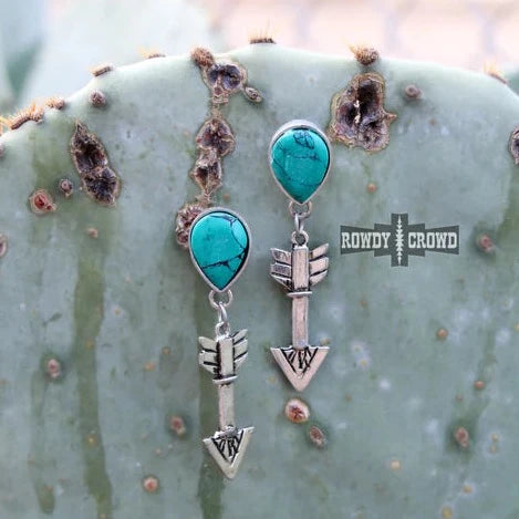 Turquoise arrow earrings on cactus