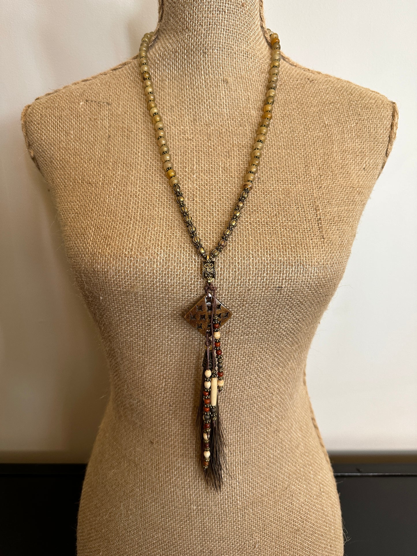 Beaded necklace on mannequin
