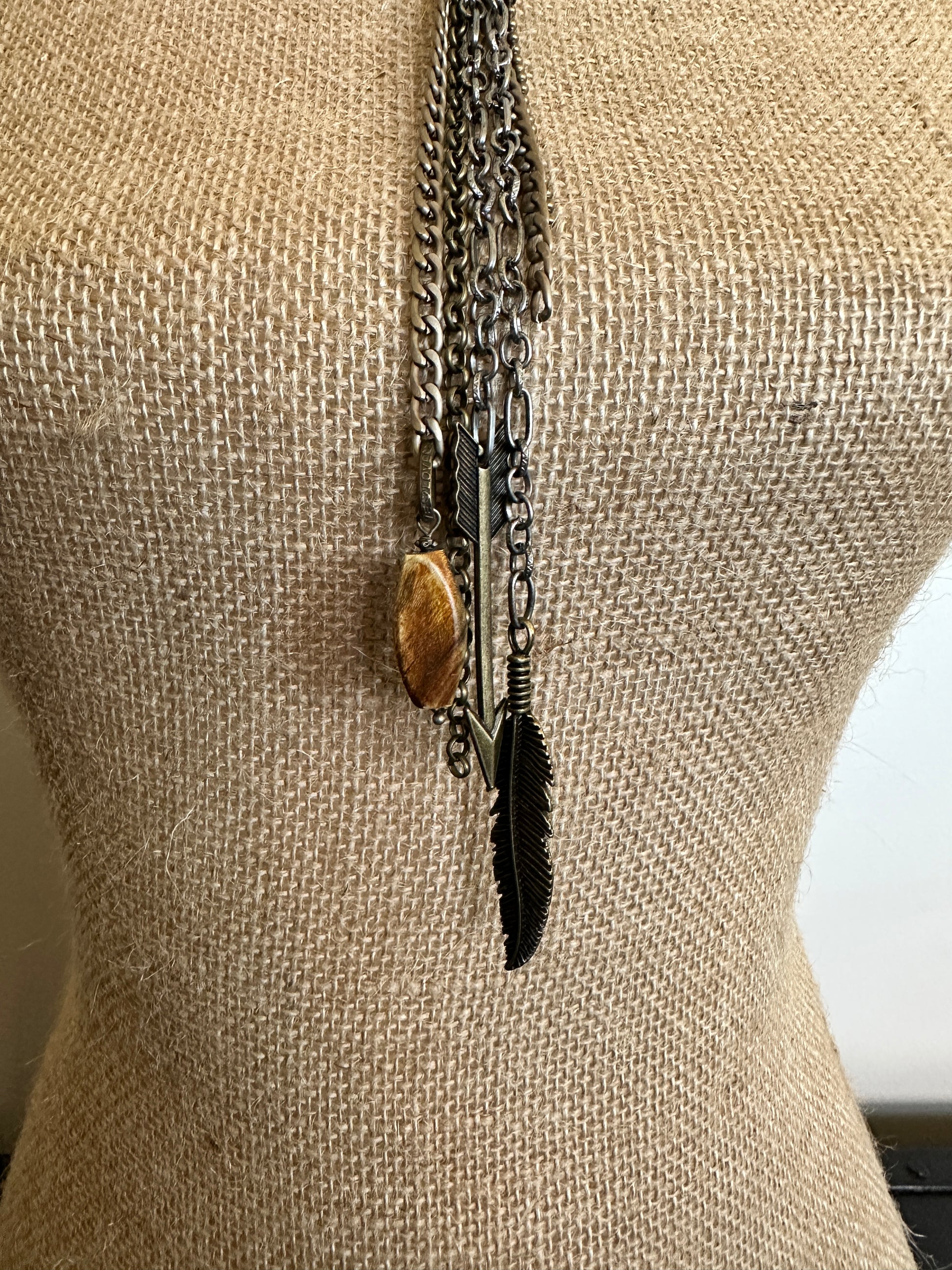 Necklace with feather and stone pendants.