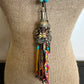 Bohemian style necklace with turquoise beads and colorful tassel.