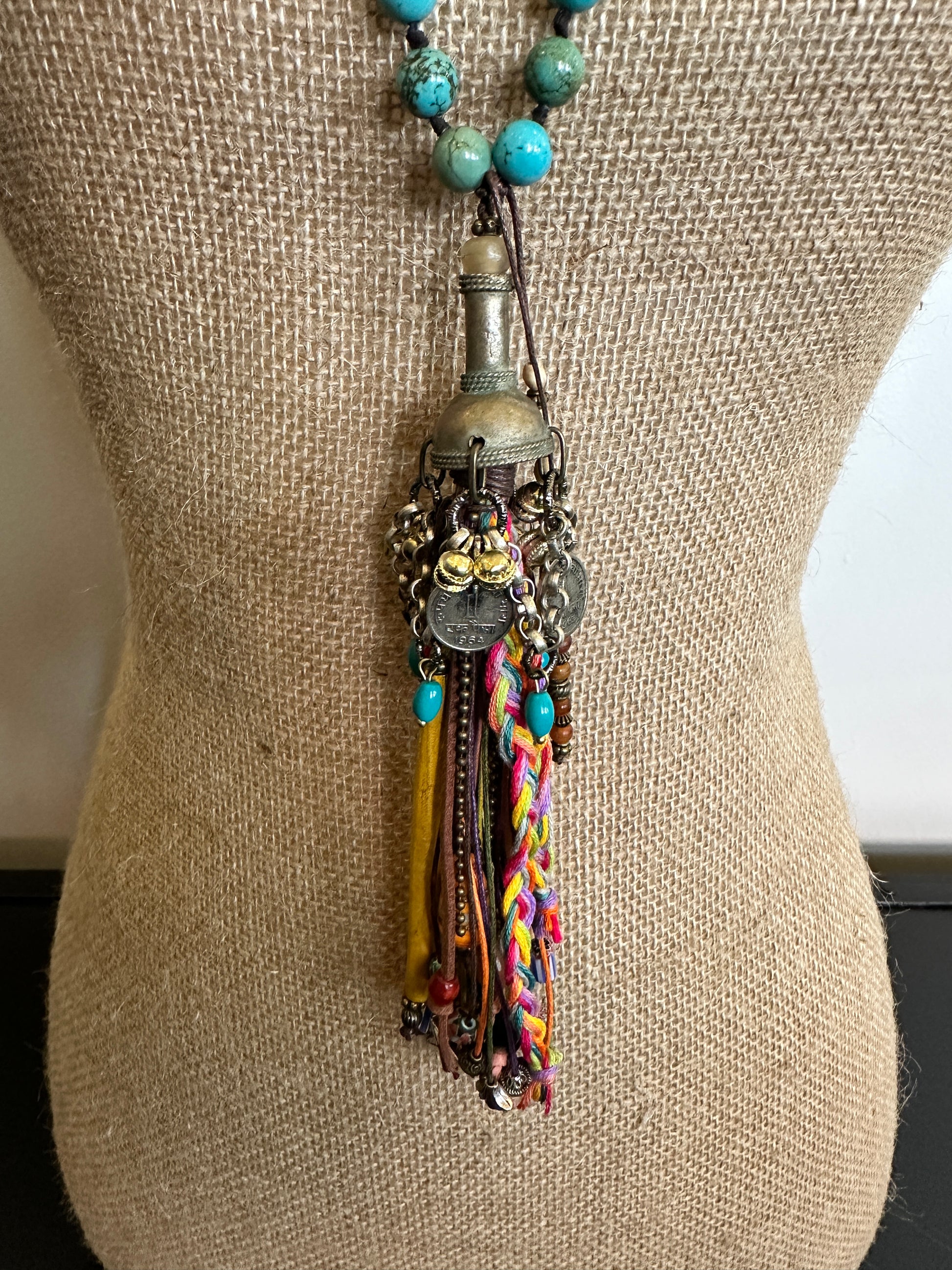Bohemian style necklace with turquoise beads and colorful tassel.