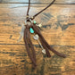Leather necklace with charms.