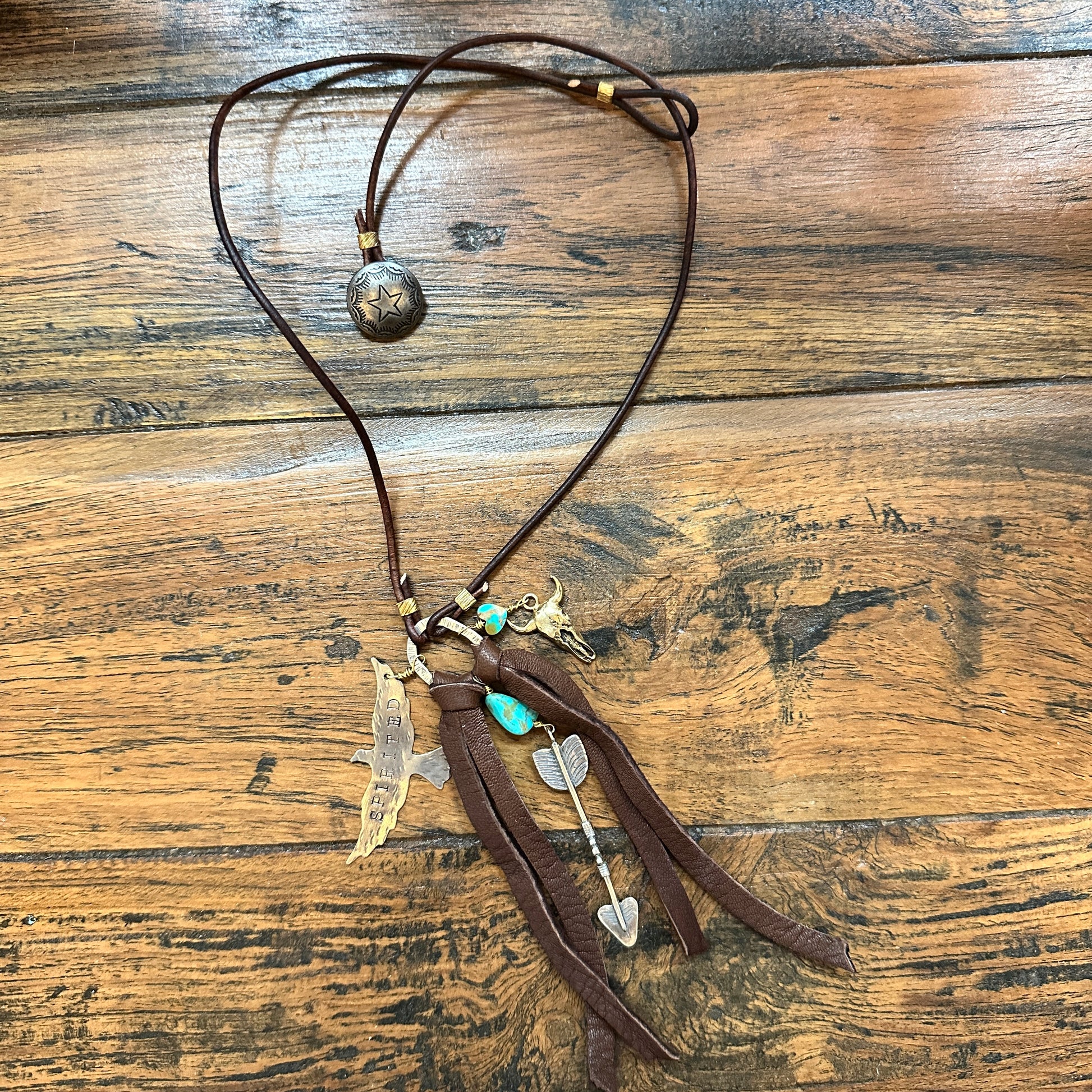 Leather necklace with charms.