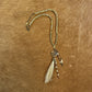 Beaded necklace with pendant and tassels.