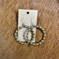 Hoop earrings with small beads on display card.