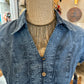 Blue denim shirt on a mannequin.