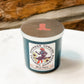 Blue candle with Bourbon Cowgirl label and boot lid.