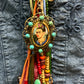 Frida Kahlo pendant with colorful beads.