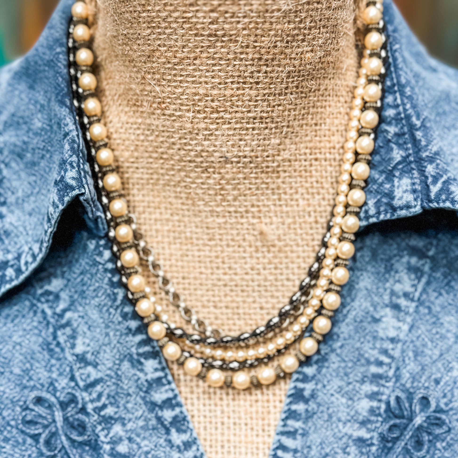 Vintage layered pearl necklace on display