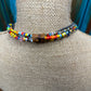 Beaded necklace on a mannequin.