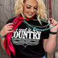 Woman wearing It's Cool to be Country shirt and accessories