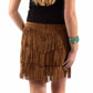 Woman in fringe skirt and boots