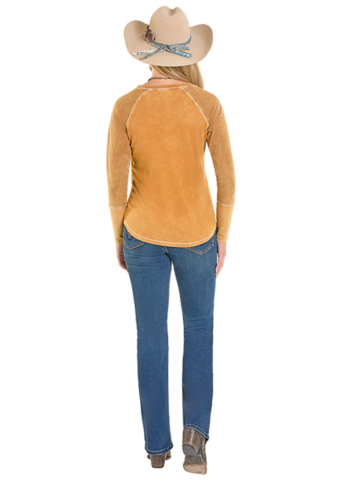 Woman in jeans, shirt, and cowboy hat.