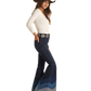 Woman in flared jeans and cowboy hat