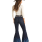 Cowgirl in flared jeans and hat