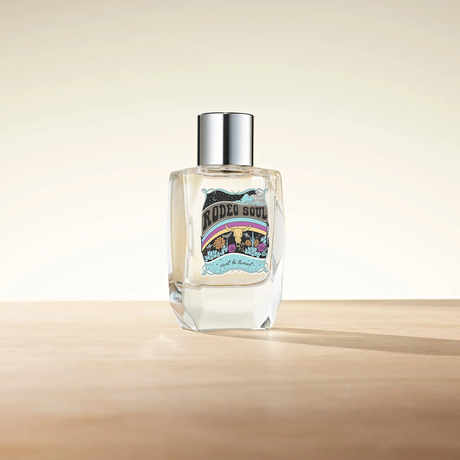 Rodeo Soul perfume bottle on wooden surface