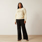 Woman wearing Ariat sweatshirt and black pants
