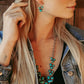 Woman wearing Stagecoach turquoise jewelry